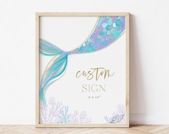 May include: A custom sign featuring a watercolor illustration of a mermaid tail with purple, blue, and gold accents. The tail is surrounded by coral and seashells. The sign reads "Custom Sign 8 x 10"