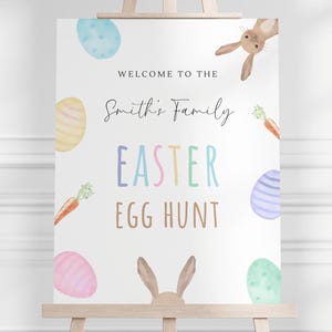 May include: Welcome to the Smith's Family Easter Egg Hunt sign with a bunny rabbit, carrots, and colorful eggs.