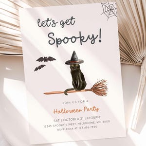 May include: Halloween party invitation with a black cat wearing a witch hat and riding a broom. The invitation reads "let's get Spooky!" with bats and a spiderweb graphic. Includes party details.