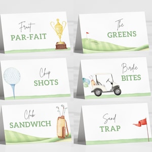 May include: Set of six white tent cards with watercolor golf-themed illustrations and text. Designs include a trophy, golf ball, golf cart, and golf course elements. Text includes "Fruit Parfait", "The Greens", "Chip Shots", "Birdie Bites", "Club Sandwich", and "Sand Trap".
