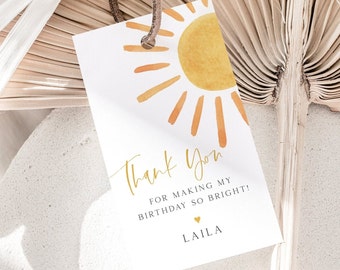 May include: A white thank you tag with a gold sun illustration and the text "Thank You for making my birthday so bright!" with the name "Laila" at the bottom.