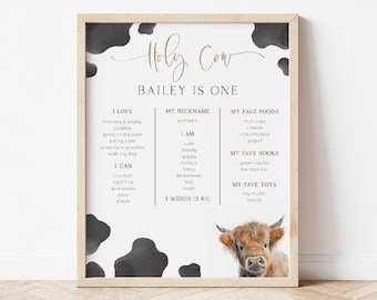 May include: A printable chart with a cow illustration and the text "Holy Cow Bailey is One". The chart lists the child's favorite things, including foods, books, and toys.