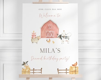 Könnte beinhalten: Ein weißes Willkommens-Schild mit einem rosafarbenen Stall, Bauernhoftieren und dem Text "OINK, CLUCK. BAA. MOO Willkommen zu MILA'S Second birthday party!"