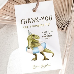 May include: Thank you for stomping by! A green dinosaur wearing a blue party hat and a blue and white life preserver. The dinosaur is smiling. The text reads "Thank you for stomping by! I hope you had a dinomite time! Love, Jayden."