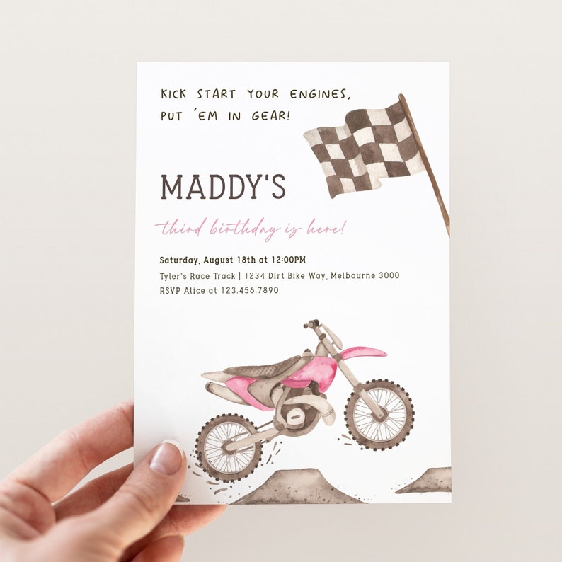 May include: A pink and white birthday invitation with a checkered flag and a pink dirt bike. The invitation says "Maddy's third birthday is here!" and includes the date, time, and location of the party. RSVP information is also included.