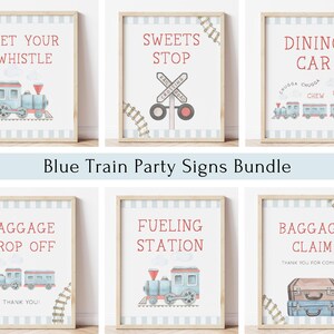May include: A set of ten blue train party signs with watercolor illustrations. The signs feature phrases like "Wet Your Whistle", "Sweets Stop", "Dining Car", "Baggage Drop Off", "Fueling Station", and "Baggage Claim".