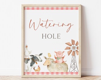 May include: A printable sign with a red gingham border and the text "Watering Hole" in red script. The sign features a watercolor illustration of a cow, sheep, pig, chicken, and goose, along with a windmill.