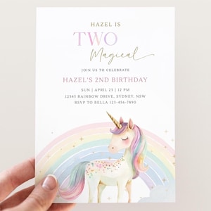 May include: A birthday invitation featuring a unicorn and rainbow illustration. The text reads "HAZEL IS TWO Magical" and includes party details. The invitation is held by a hand.