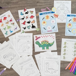 May include: A set of printable dinosaur-themed educational worksheets for kids. The worksheets include coloring pages, matching activities, and a dinosaur life cycle diagram. The worksheets are printed on white paper and feature colorful illustrations of dinosaurs.