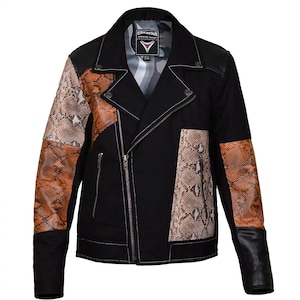 May include: Black motorcycle jacket with snake skin pattern accents in brown and tan. The jacket features a zipper closure, black leather sleeves, and white stitching details. The jacket has the brand name "KINTA" on the collar.
