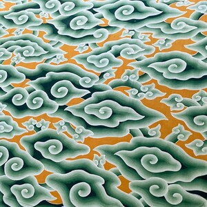 May include: An abstract pattern featuring stylized green and white clouds against an orange background. The clouds have a layered, swirling design, creating a sense of depth and movement. The overall aesthetic is reminiscent of traditional Asian art.