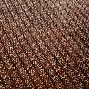 May include: Close-up of a brown fabric with a repeating floral pattern in a diagonal grid. The pattern features a dark brown background with lighter brown and cream-colored floral designs. The fabric has a textured appearance.