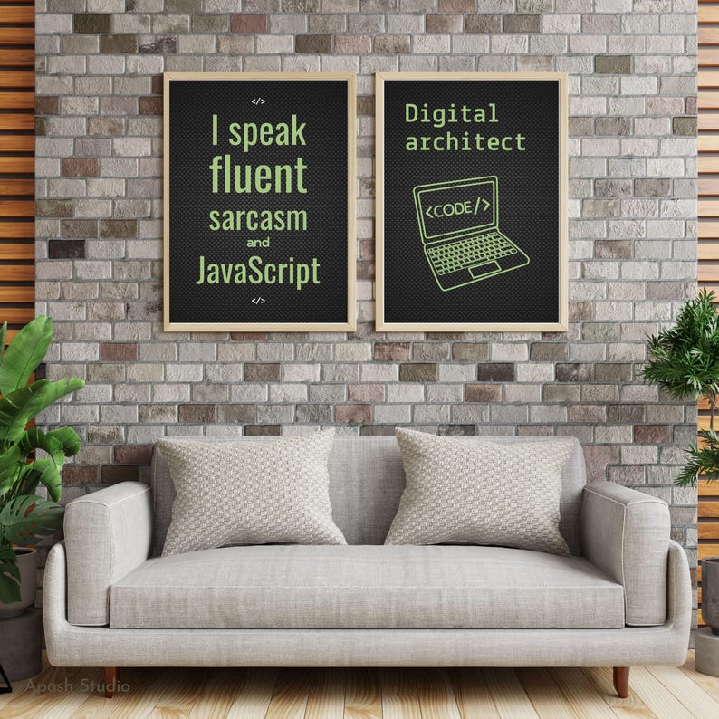 May include: Two framed posters with text on a brick wall. One reads "I speak fluent sarcasm and JavaScript." The other says "Digital architect" with a laptop graphic. A grey sofa with two cushions sits below.