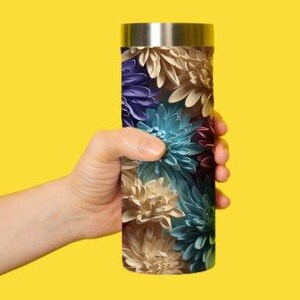 May include: A stainless steel travel mug with a floral pattern featuring shades of blue, purple, and brown.