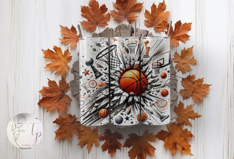 May include: Three stainless steel tumblers with a basketball theme. The tumblers feature a black and white graphic of a basketball breaking through a wall with basketballs, trophies, and a basketball hoop. The tumblers are surrounded by fall leaves.