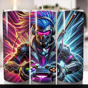 May include: A set of three stainless steel tumblers with a colorful design featuring a futuristic gamer holding a video game controller. The design includes neon pink, blue, and green colors.