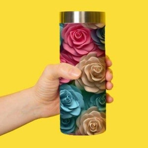 May include: A stainless steel tumbler with a floral design featuring pink, blue, and beige roses.