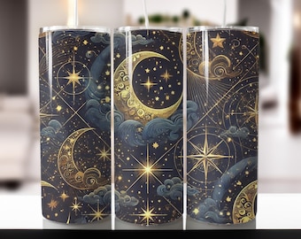 May include: Three stainless steel tumblers with a celestial design. The pattern features gold moons, stars, and compass roses on a dark blue background. The design includes stylized clouds and intricate line work, creating a mystical aesthetic.