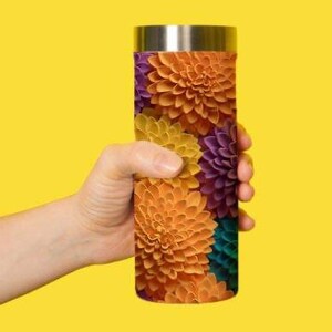 May include: A stainless steel travel mug with a colorful floral pattern. The pattern features orange, yellow, purple, and teal flowers.