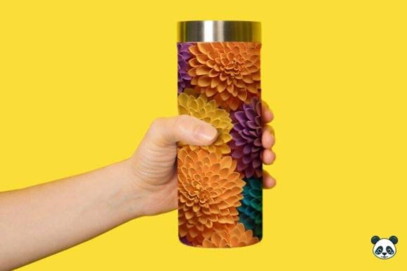 May include: A stainless steel travel mug with a colorful floral pattern. The pattern features orange, yellow, purple, and teal flowers.