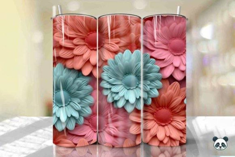 May include: Three stainless steel tumblers with a floral design. The tumblers feature a close-up of pink and blue flowers.