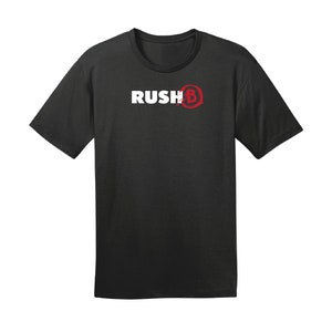 May include: Black t-shirt with white text that reads "Rush B" and a red circle with a white "B" inside.
