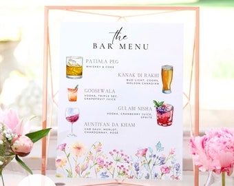 May include: A watercolor illustration of a bar menu with a floral border. The menu lists different drinks with their ingredients, including "Patiala Peg", "Kanak Di Rakhi", "Goosewala", "Gulabi Nisha", and "Auntiyan Da Kham". The text "the PRETTY PAPIER CO" is at the bottom of the menu.