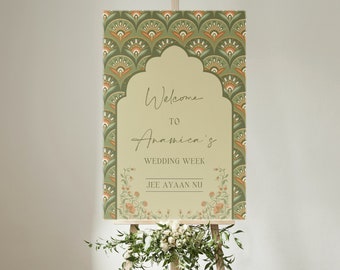 May include: A printable wedding welcome sign with a green, orange, and cream patterned background. The sign says "Welcome to Anamica's Wedding Week Jee Ayaan Nu".