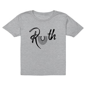 May include: A gray t-shirt with a black graphic of the name "Ruth" with a stylized black collar design.