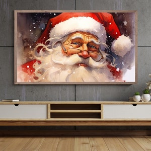 Puede incluir: Una pintura de acuarela de Santa Claus con barba blanca y gorro rojo. El fondo es azul oscuro con copos de nieve blancos.
