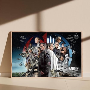 以下が含まれることがあります： スターウォーズシリーズ「Andor」のキャストが描かれた額入りのポスター。宇宙と建築要素を背景に、キャラクターのコラージュが特徴です。「Andor Season 2」のタイトルが表示されています。