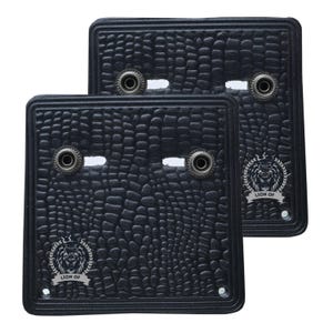 May include: Two black, textured rectangular mats with a reptile skin pattern. Each mat has two metal grommets and a white rectangular opening. The mats feature a silver lion crest with the text "LION OF".