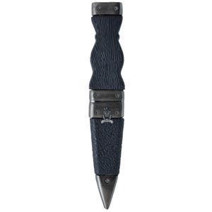 May include: A dark blue dagger with a textured handle and a silver-colored blade. The handle has a unique, curved design. The dagger has a metal sheath with a lion emblem and the text "LION OF".