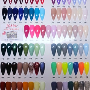 May include: A color chart with 87 different nail polish colors. The colors are arranged in rows and columns. The chart is labeled with numbers from 001 to 087. The text "Love what's inside?" is printed on the chart. The text "Snap-Share-Review" is printed on the chart.