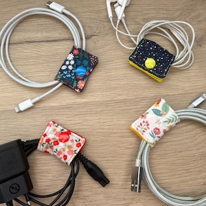 Cable organizer, cable holder, fabric cable ties for various cables, chargers, headphones