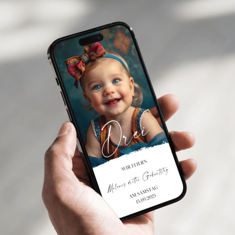 May include: A phone screen displaying a birthday invitation for a child turning three. The invitation features a photo of a smiling child with a red bow in their hair, the word "Drei" in white script, and the text "Wir feiern Melinas dritten Geburtstag am Samstag 15.09.2023".