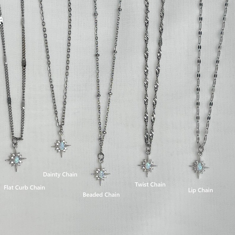 May include: Five silver chains with star-shaped pendants featuring a white opal stone. The chains are labelled "Flat Curb Chain", "Dainty Chain", "Beaded Chain", "Twist Chain", and "Lip Chain".