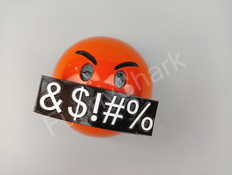 May include: An orange emoji with angry eyebrows and eyes, and a black rectangle covering the mouth with white symbols: & $ ! # %.