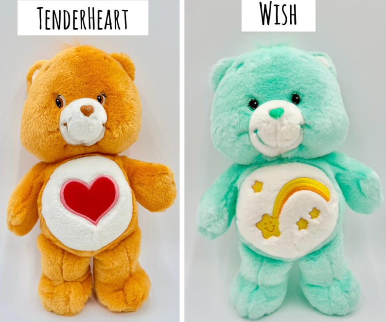 May include: Two plush bear toys. The left bear is orange with a red heart emblem on its white belly and the text Tenderheart above it. The right bear is mint green with a yellow shooting star and rainbow emblem on its white belly and the text Wish above it.