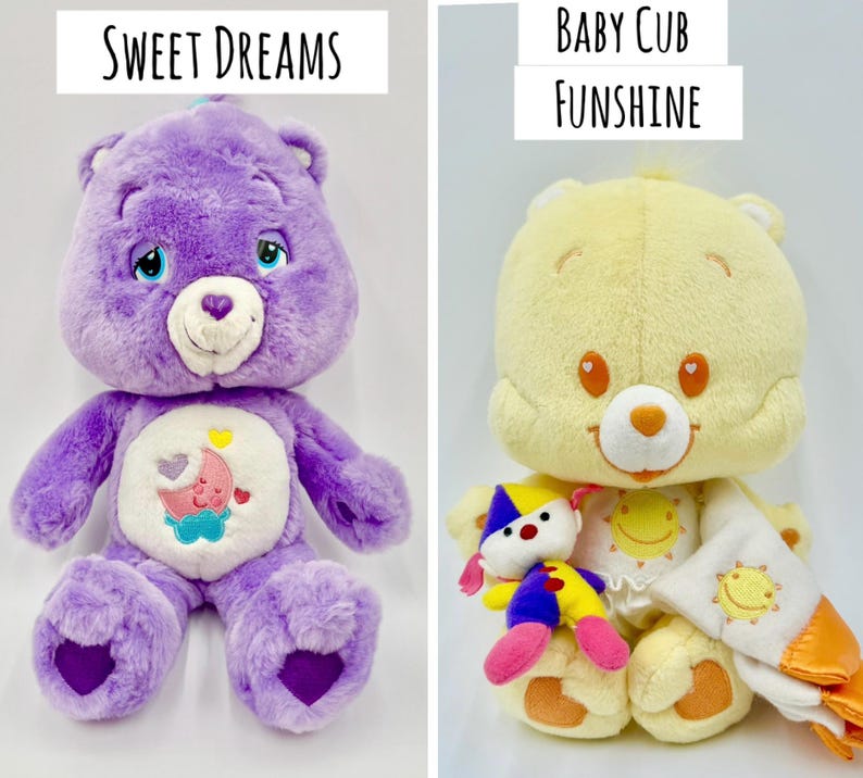 May include: Two plush bear toys. The left bear is purple with a white belly patch featuring a pink moon and blue cloud, labeled Sweet Dreams. The right bear is yellow with a white belly patch featuring a yellow sun, holding a small clown doll and a yellow blanket, labeled Baby Cub Funshine.