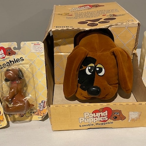 1985 Tonka Pound Puppy in open box and three 1985 posable pound puppies NIP Rare find