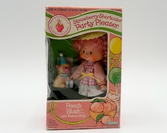 Muñeca vintage Kenner Peach Blush con Melonie Belle Party Pleaser de los años 80. Nueva en caja n.° 29190.