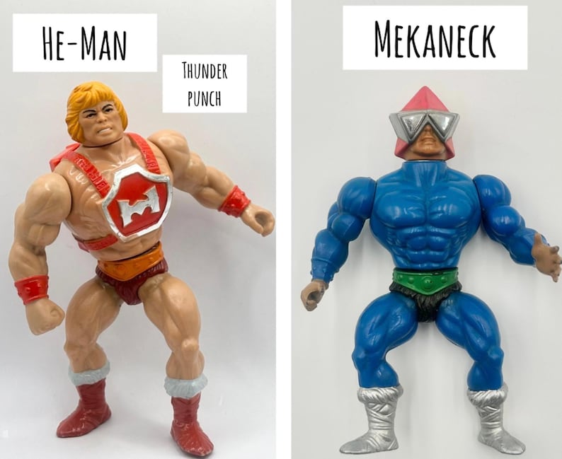 May include: Two action figures from the He-Man and the Masters of the Universe toy line. The figure on the left is He-Man, with blonde hair, a red harness, and red boots. The figure on the right is Mekaneck, with a blue body and a red helmet.