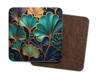 May include: Square coaster with a teal, gold, and navy floral design. The coaster features a detailed art nouveau style pattern with gold outlines and a dark background. The second coaster is made of brown cork.