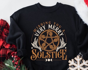 May include: Black sweatshirt with a pentagram design and the text "Wishing you a very merry solstice".