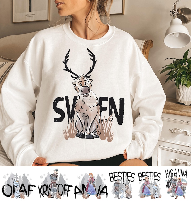 A woman wearing a white sweater with a graphic of a reindeer and the word "SVENS" printed on it.