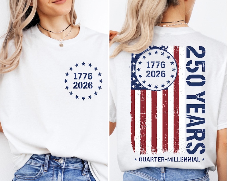 a white t-shirt with a graphic design on the back, depicting the year 1776 and the year 2026 within a circular design, along with an American flag pattern. The text on the t-shirt reads "1776 2026" and "250 YEARS" in a vertical orientation.