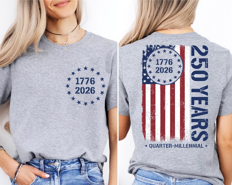 a woman wearing a grey t-shirt with a graphic design on the back. The design includes a circle with the numbers 1776 and 2026, and an American flag pattern.