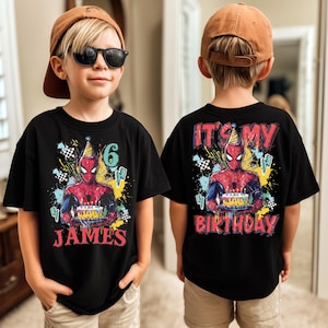 A young boy wearing a Spiderman-themed birthday t-shirt with the text "It's my birthday" printed on the back.