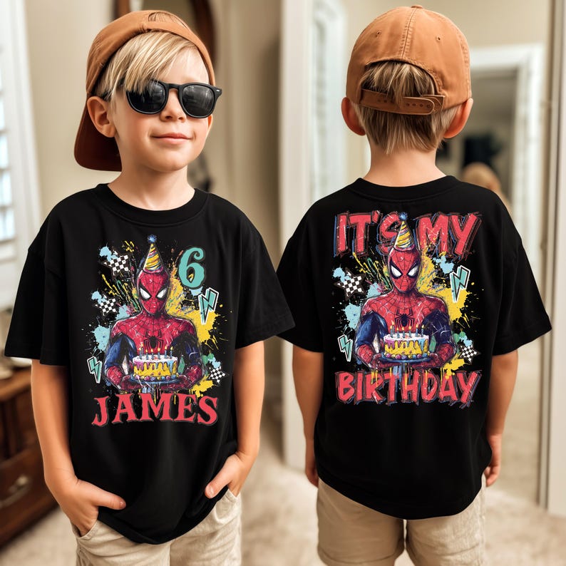 A young boy wearing a Spiderman-themed birthday t-shirt with the text "It's my birthday" printed on the back.